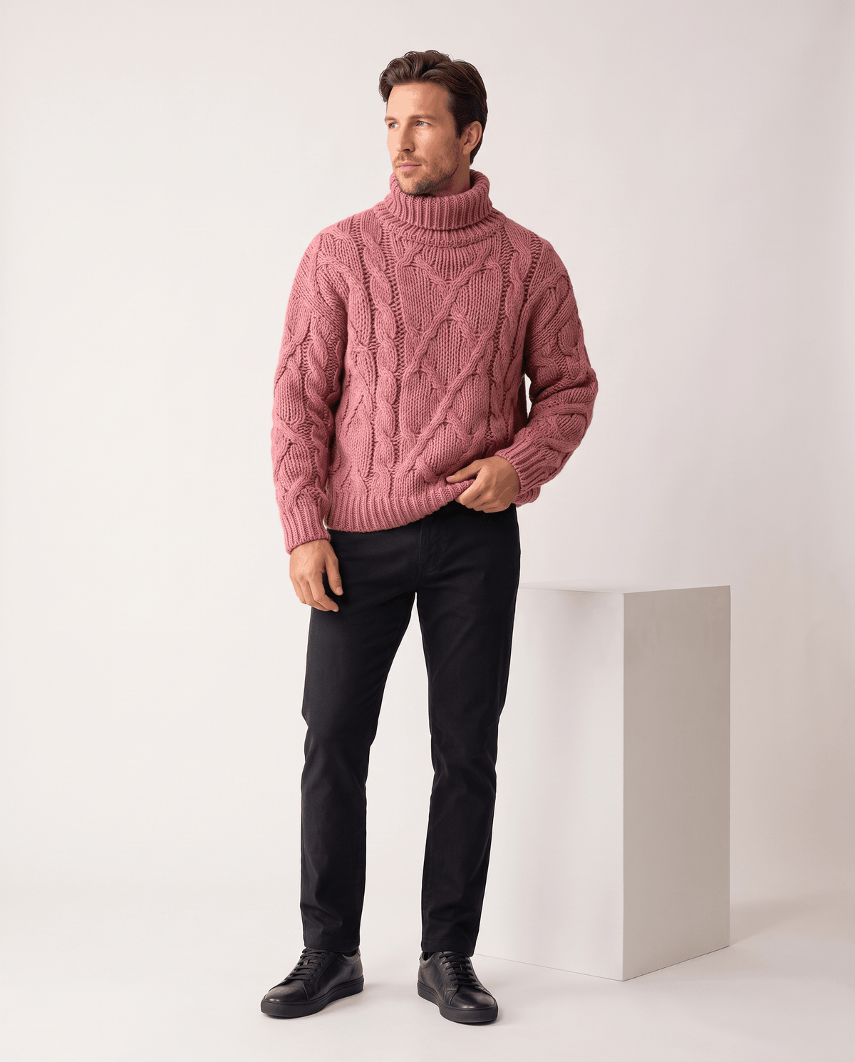 Full-length dusty pink turtleneck look with black trousers and black leather sneakers