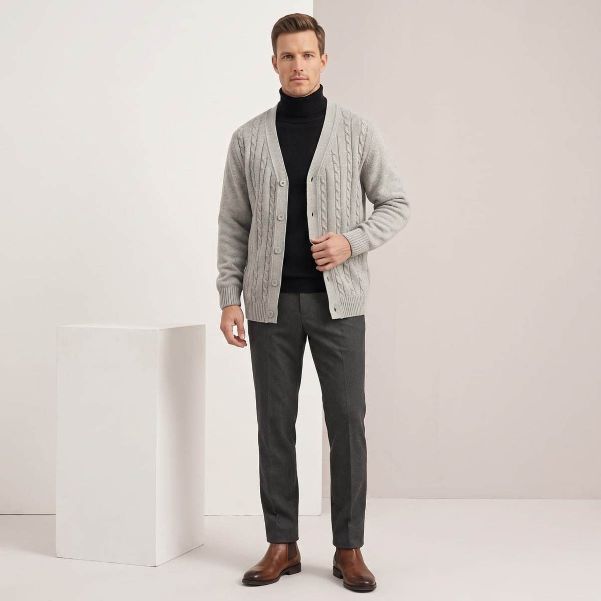 Full-length view of the gray cardigan with charcoal trousers and brown shoes