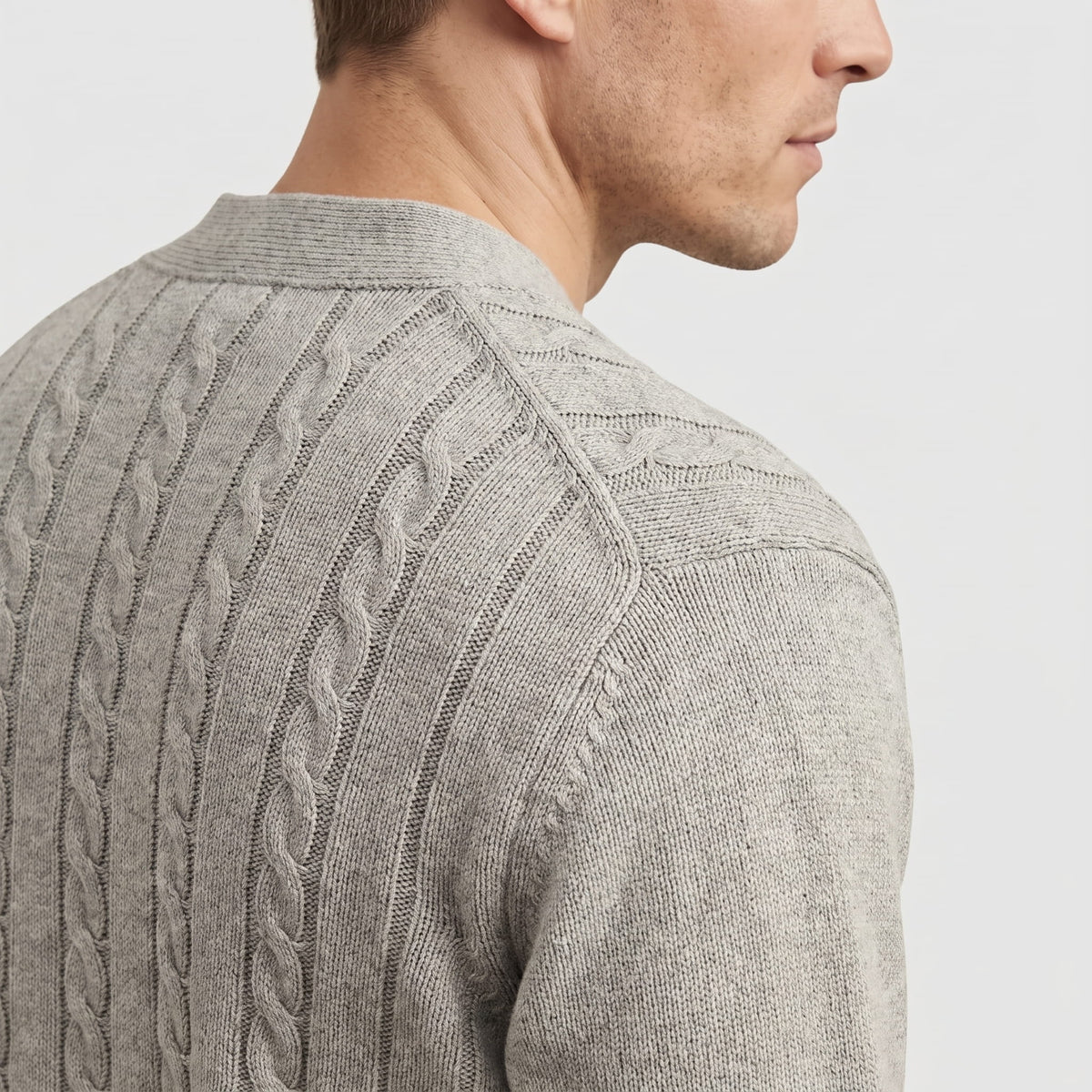 Side close-up of the gray narrow cable knit at the shoulder