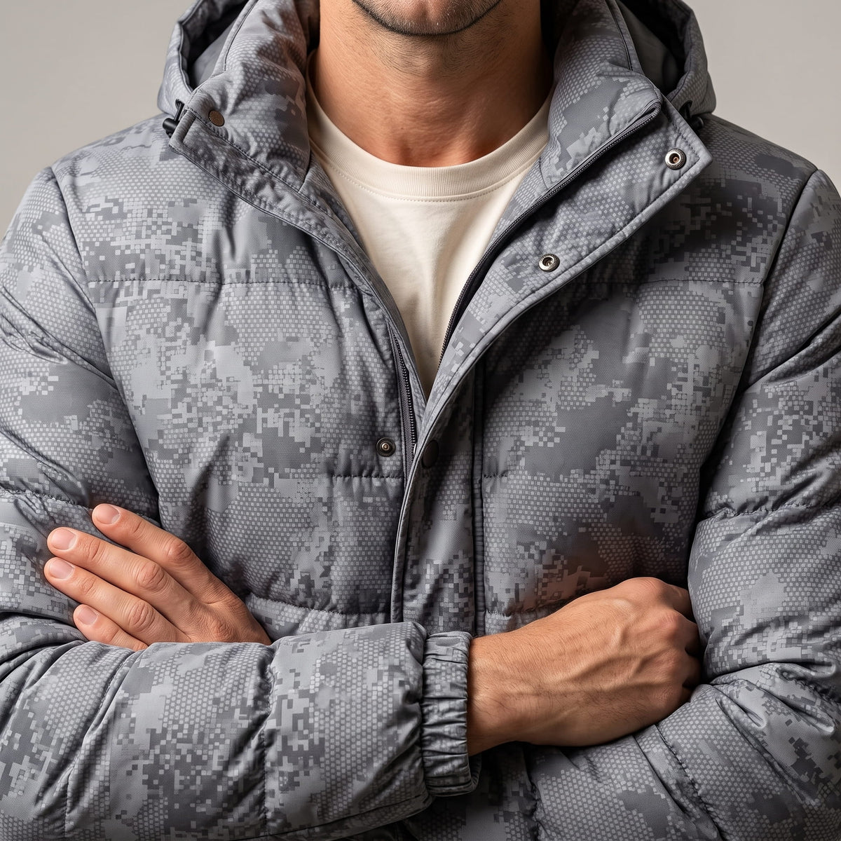 Light gray torso with arms crossed, showing the snap placket and camo print