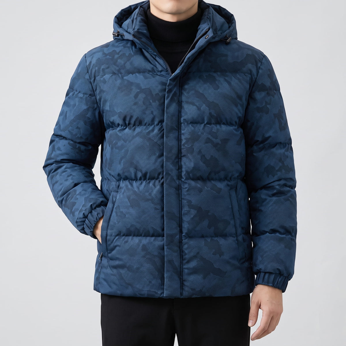 Navy jacket worn open over a black turtleneck, hood sitting at the shoulders
