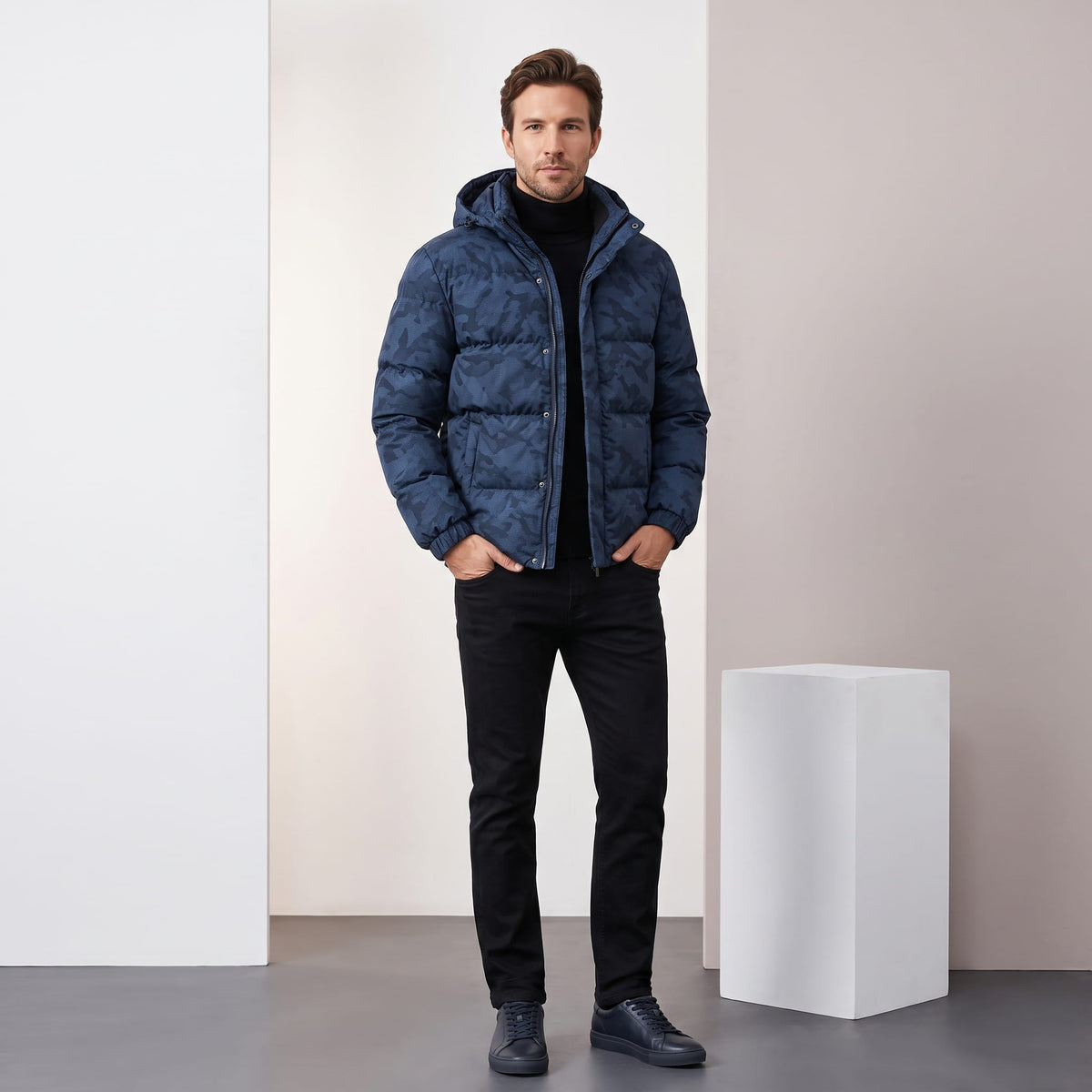 Navy jacket styled full-length with black jeans and dark leather boots