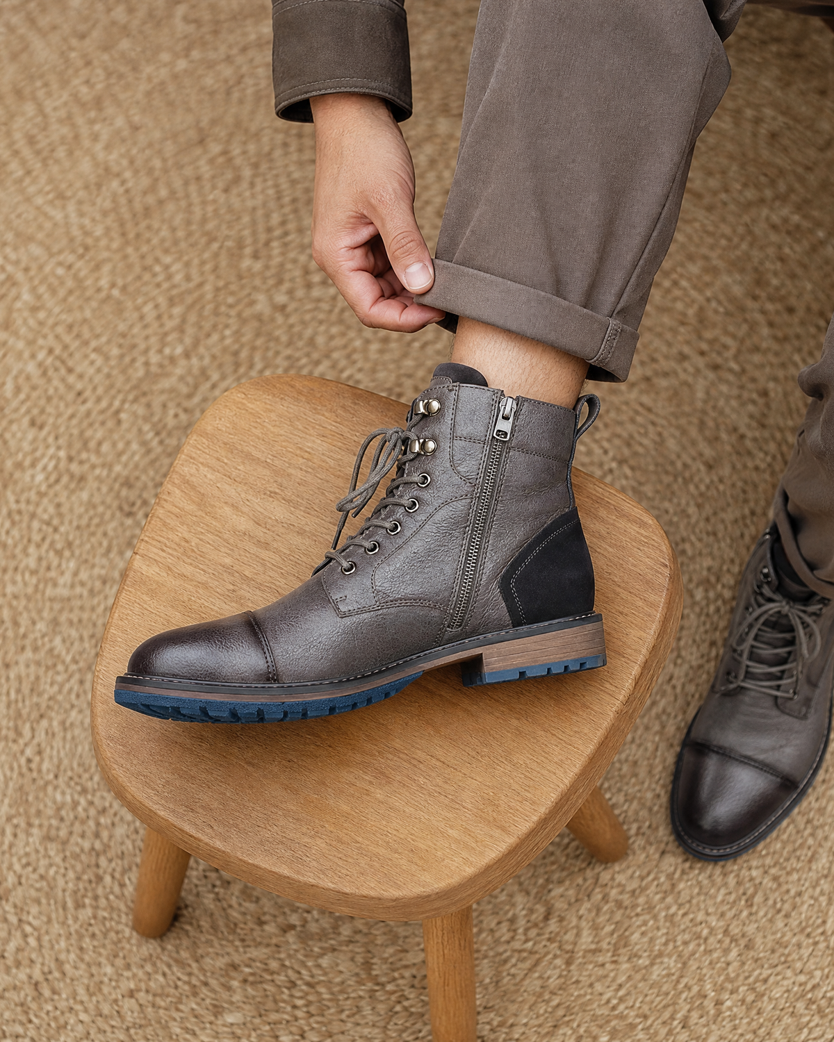 Gray smooth grain cap toe boots featuring side zip entry, lace-up front, and a durable lug rubber outsole.