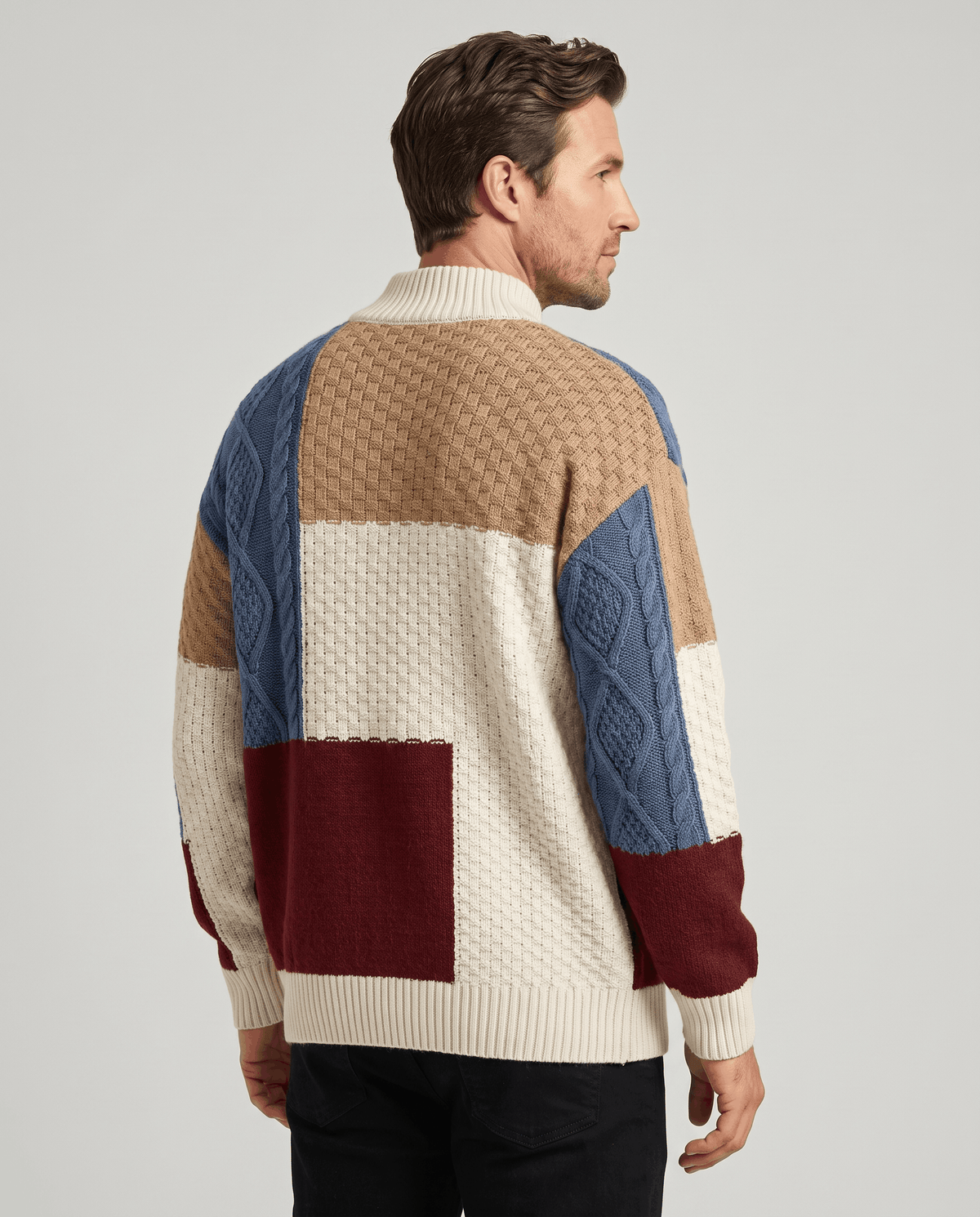 Back view of navy and cream patchwork sweater with burgundy block