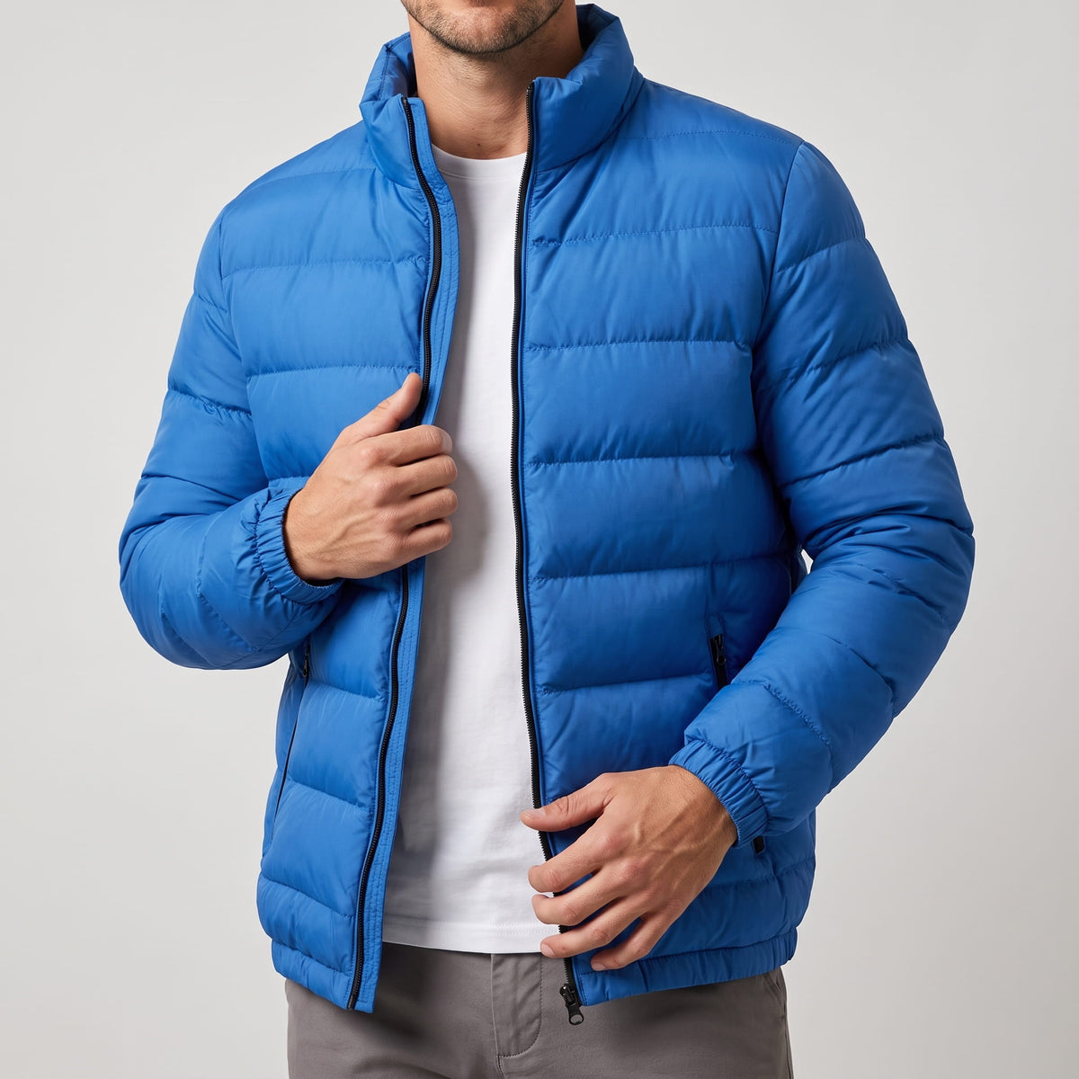 Blue jacket worn open over a white tee, collar standing upright at the neck