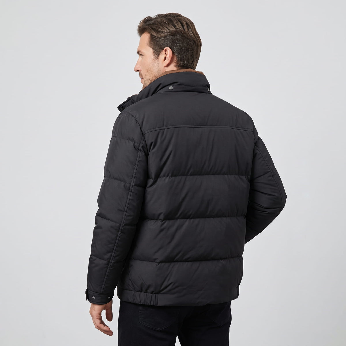 Back view of the black jacket showing the quilted blocks and hem