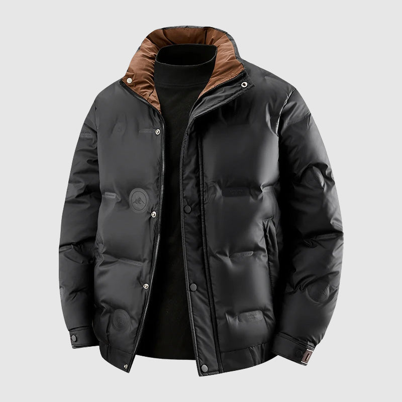 Flat product shot of the black jacket with the tan corduroy collar
