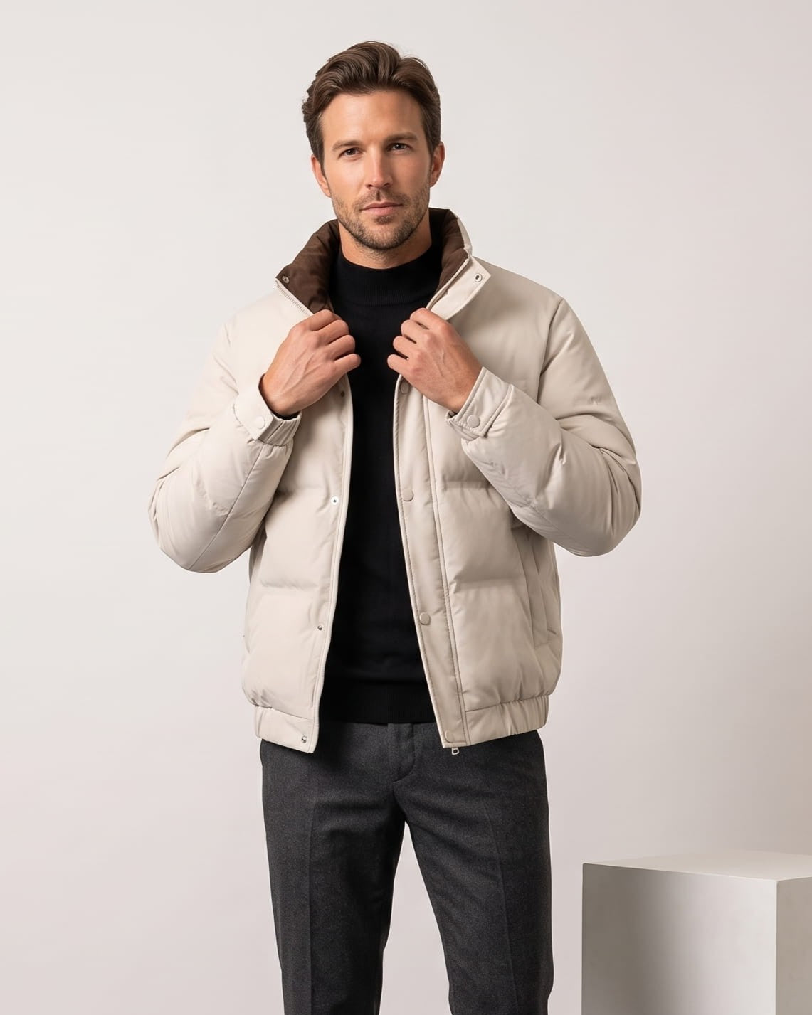 Cream colorway worn open over a black turtleneck, corduroy collar up