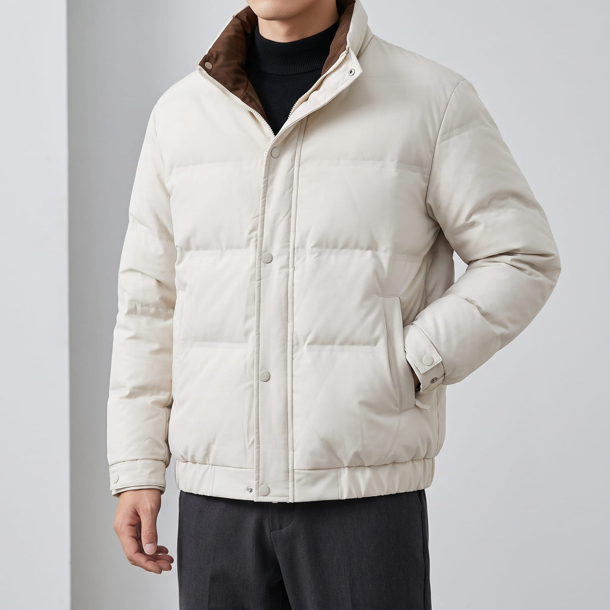 Cream jacket fastened, showing the snap front and side pockets