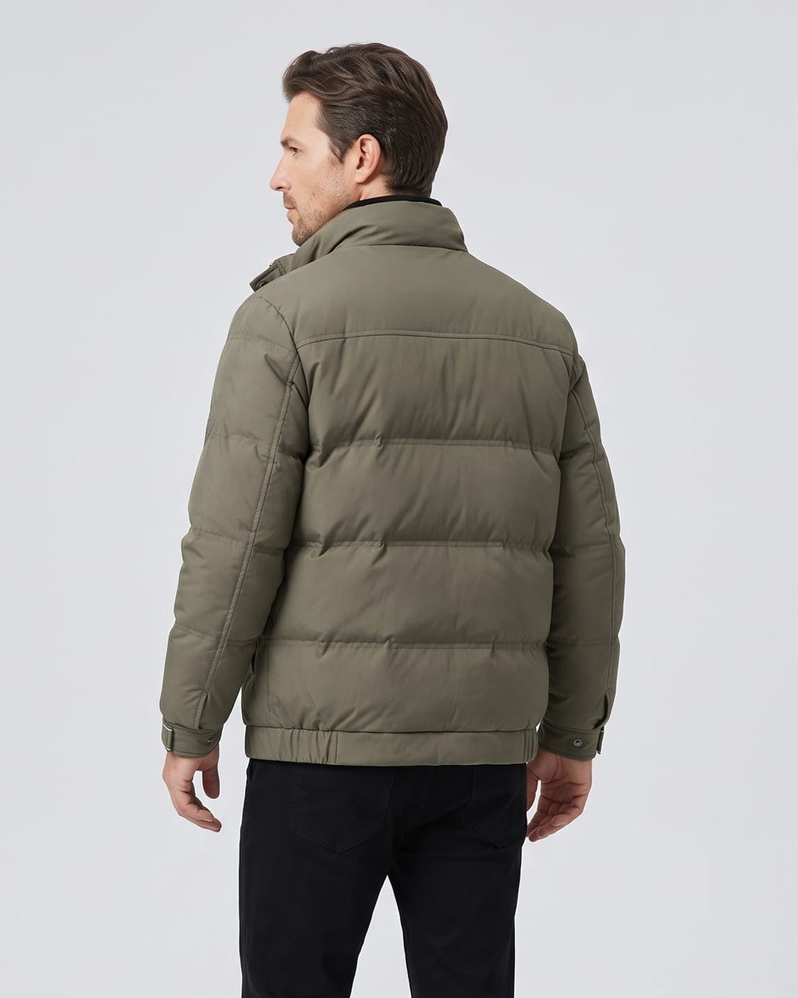 Back view of the olive jacket showing pillowed quilted blocks