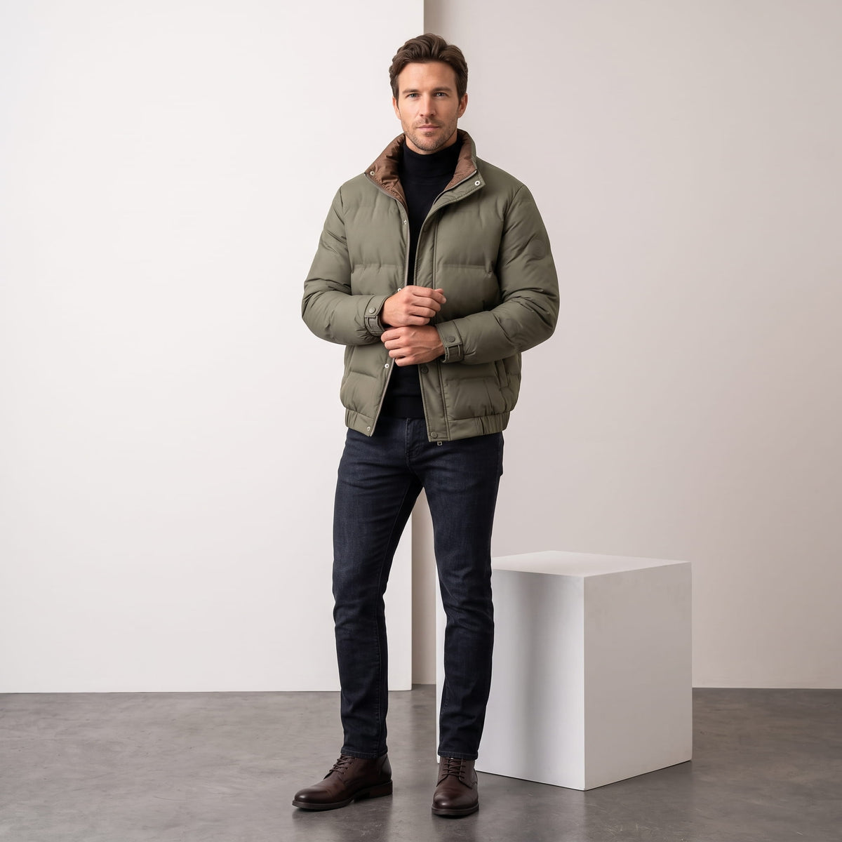 Olive jacket styled full-length with dark jeans and brown boots