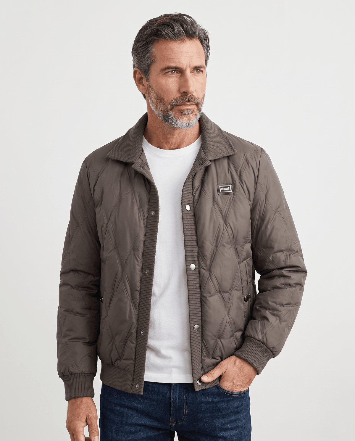 Man wearing a dark brown diamond quilted duck down puffer jacket, front view