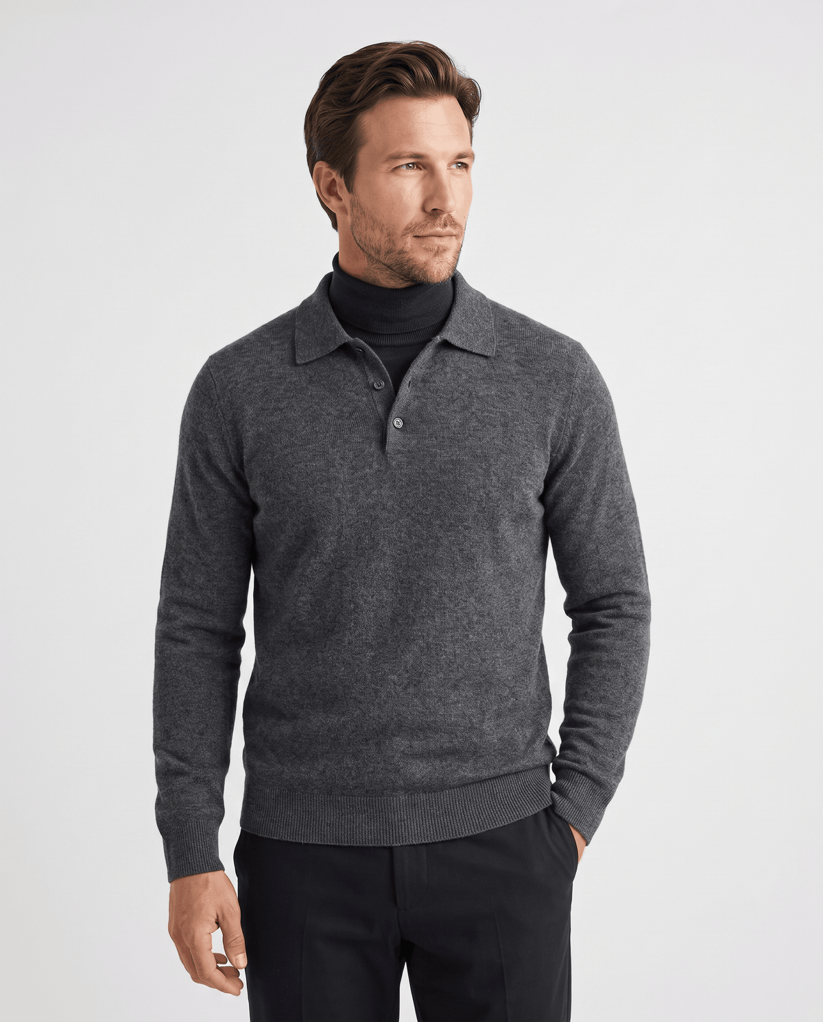 Man wearing the Elias dark gray wool knit polo sweater over a turtleneck