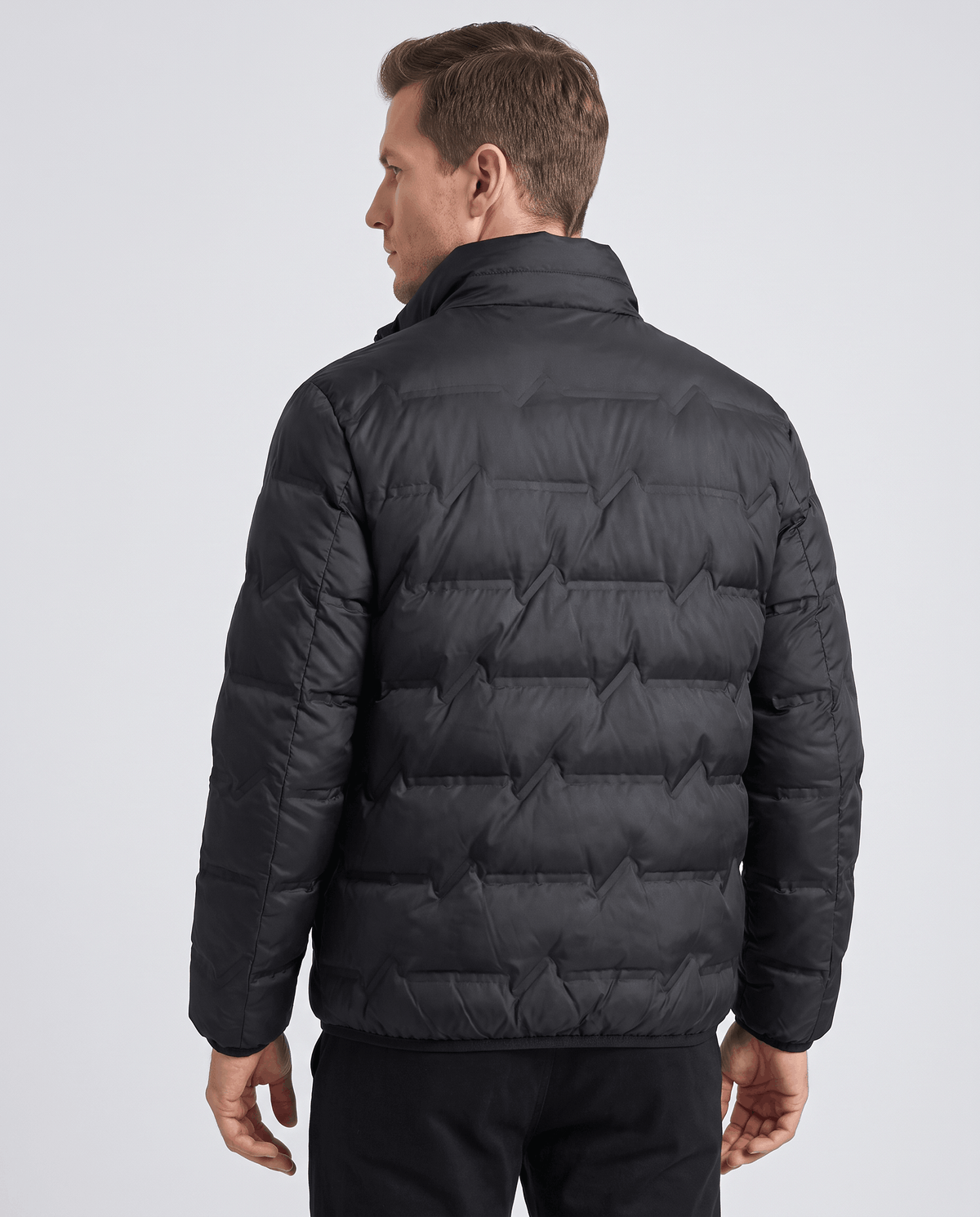 Full back view of the black colorway with chevron quilting down the body