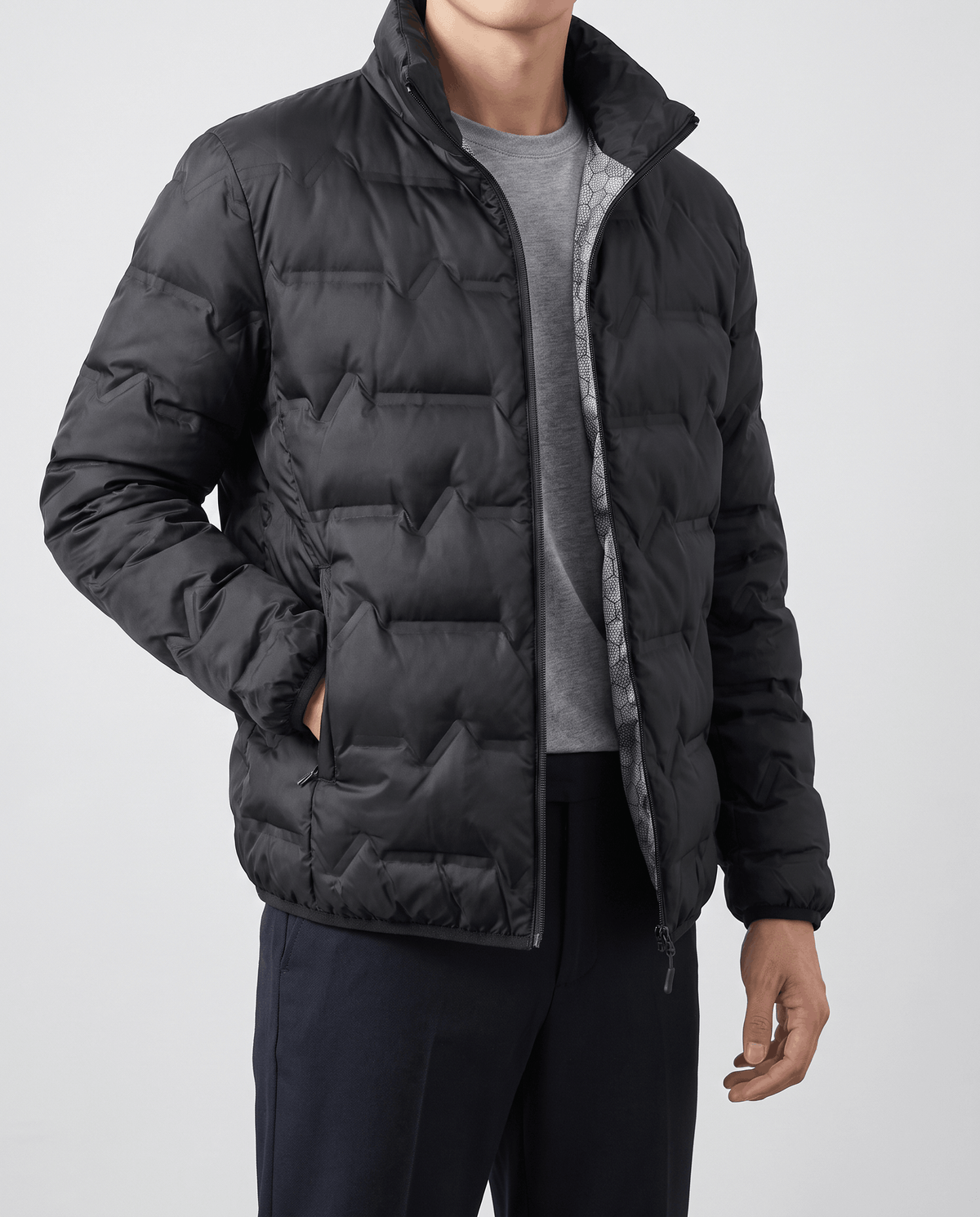Black jacket held open to show the silver-gray reflective interior lining