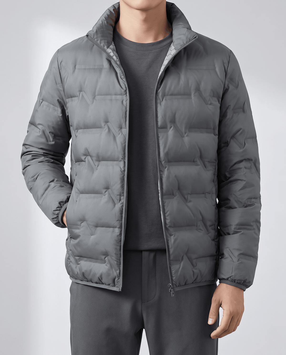 Gray jacket worn open over a charcoal tee, collar standing upright at the neck