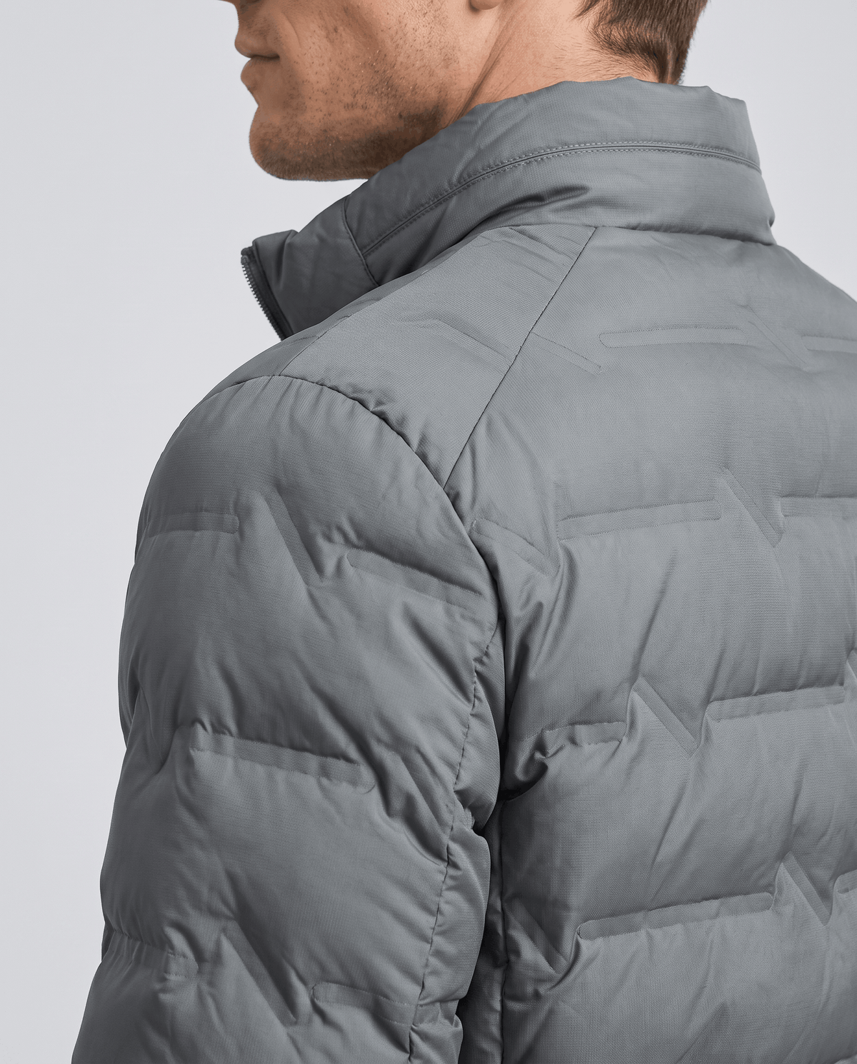 Close view of shoulder seam and raised stand collar on the gray colorway