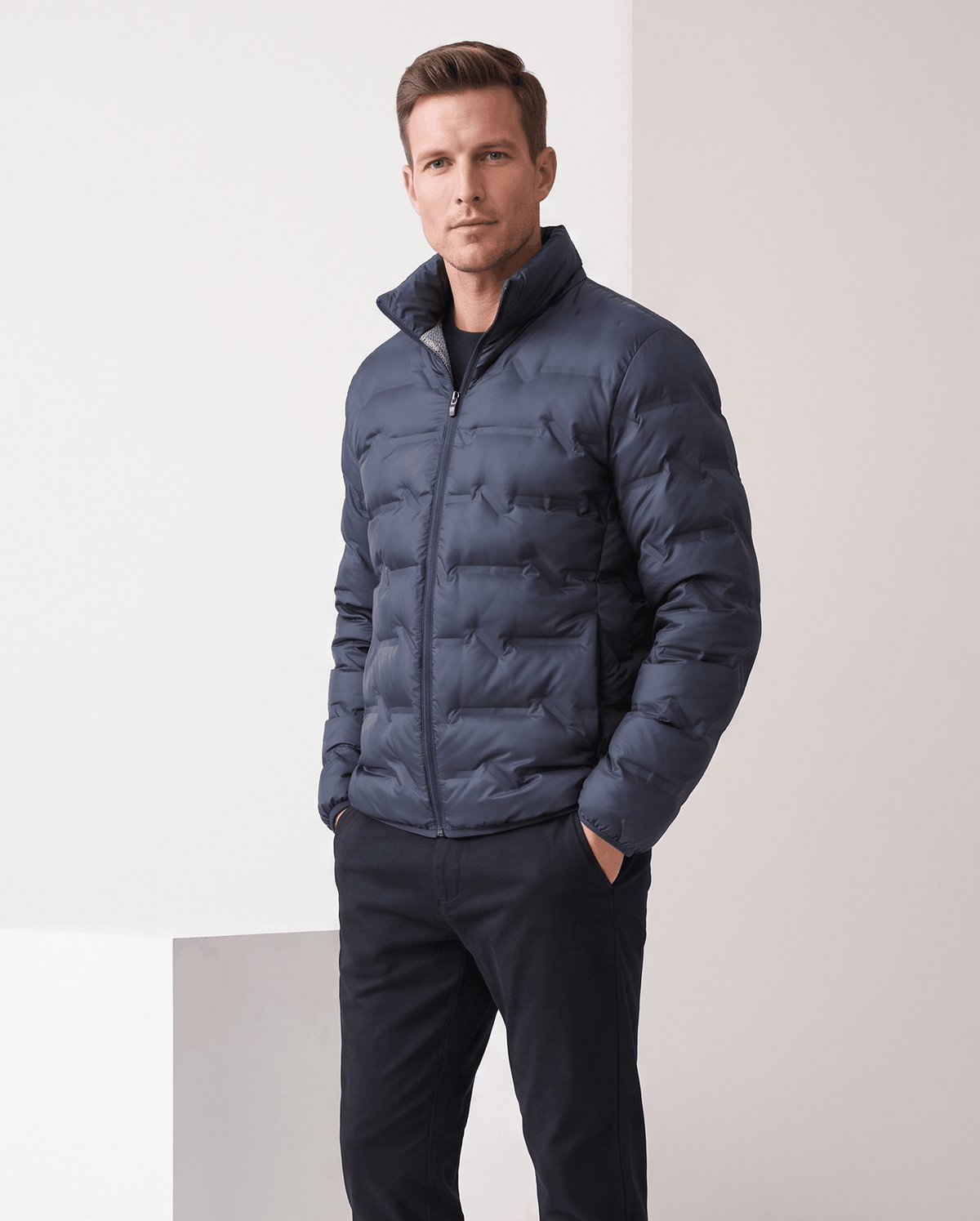 Navy blue colorway worn zipped with one hand in the side pocket