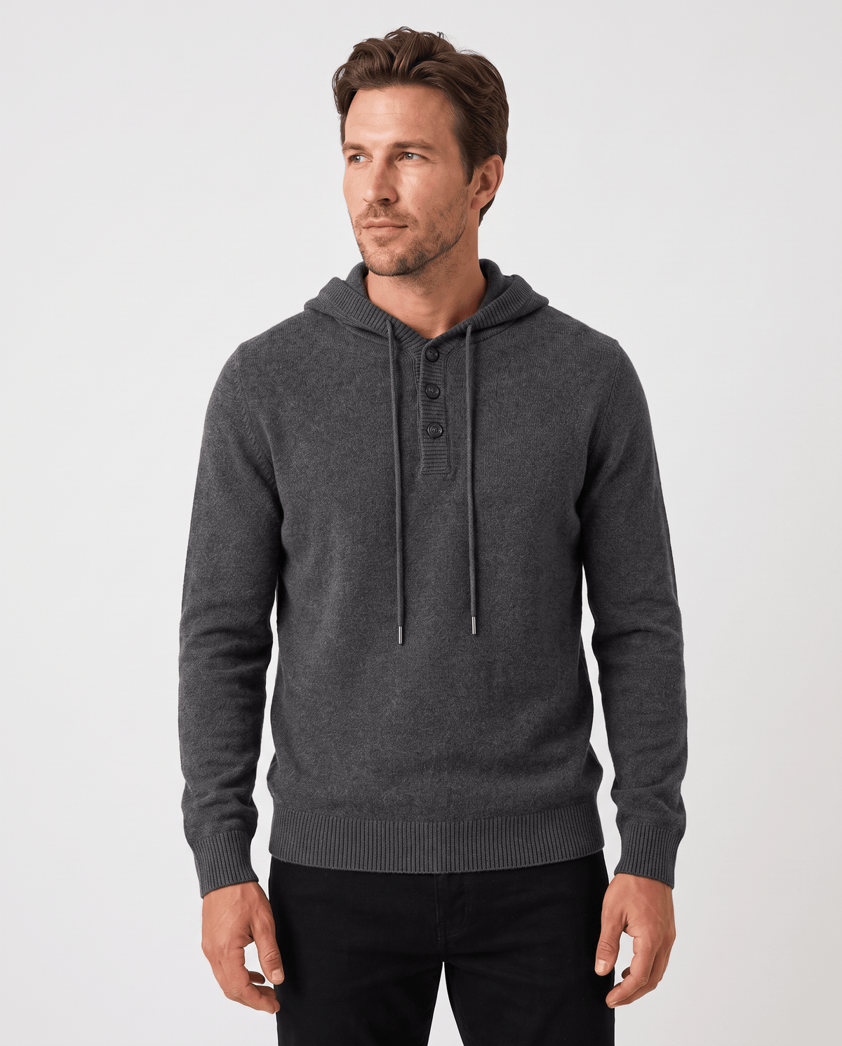 Man wearing a dark gray fine knit hoodie with a three-button placket, front view