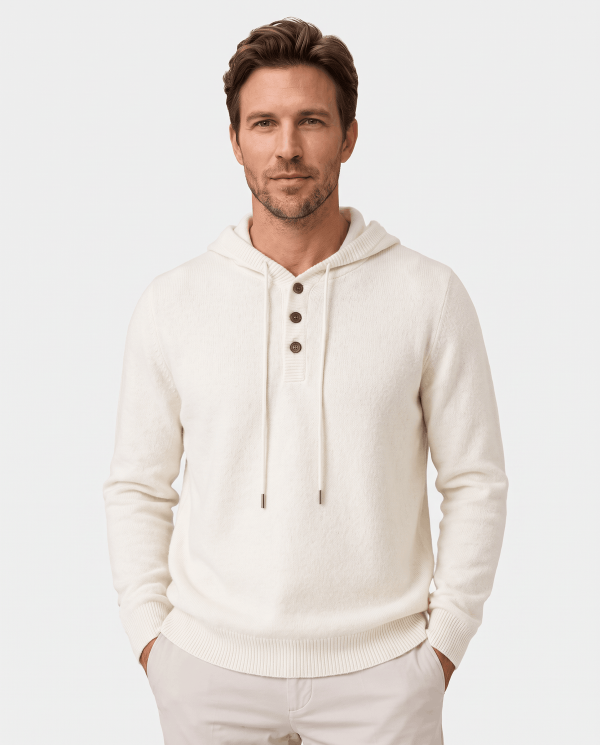 Man wearing an ivory fine knit hoodie with three-button placket and drawcords, front view