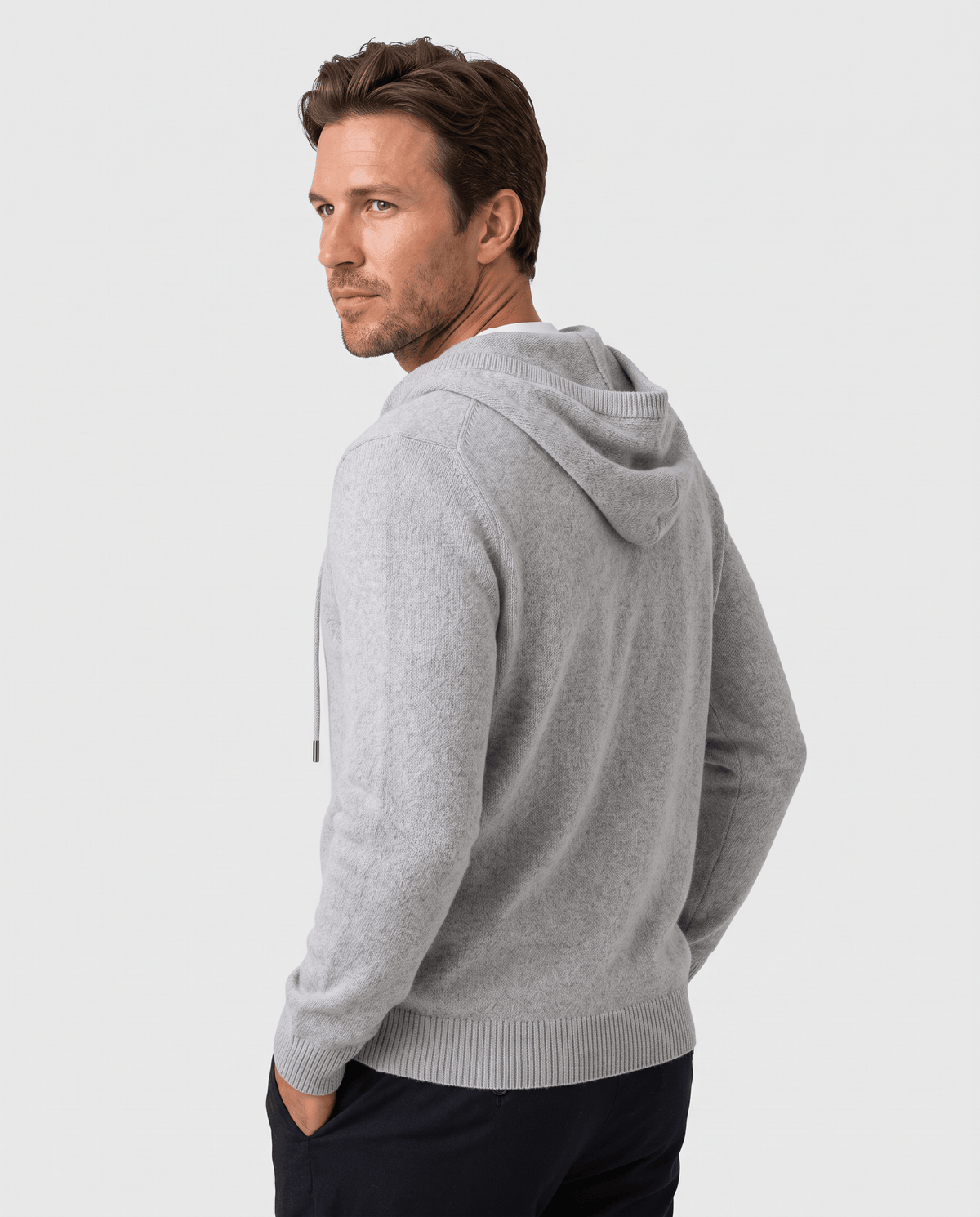Back view of a light gray knit pullover hoodie with the hood at the neck
