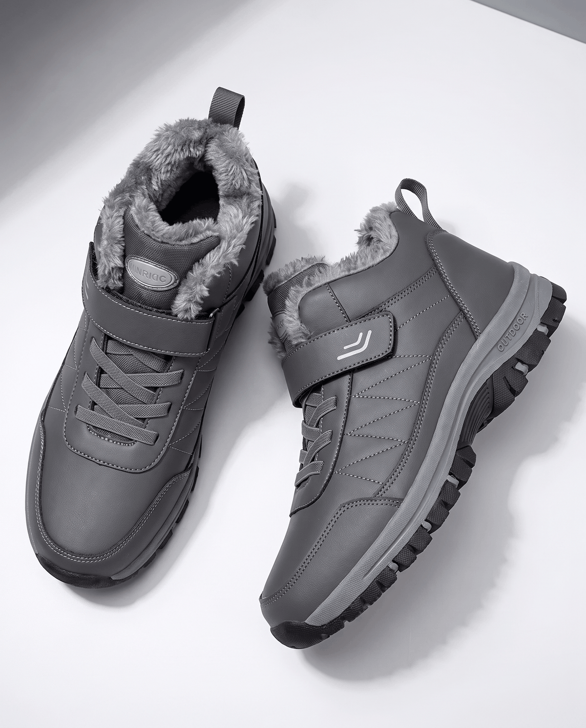 Pair of gray fleece-lined winter boots displayed from above.