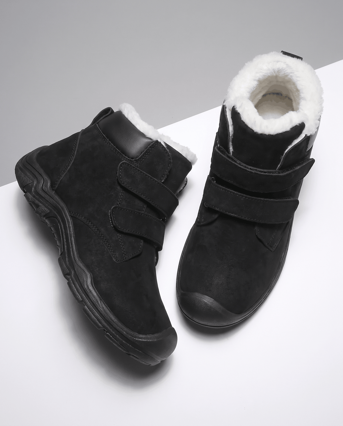 Pair of black insulated ankle boots shown from above.