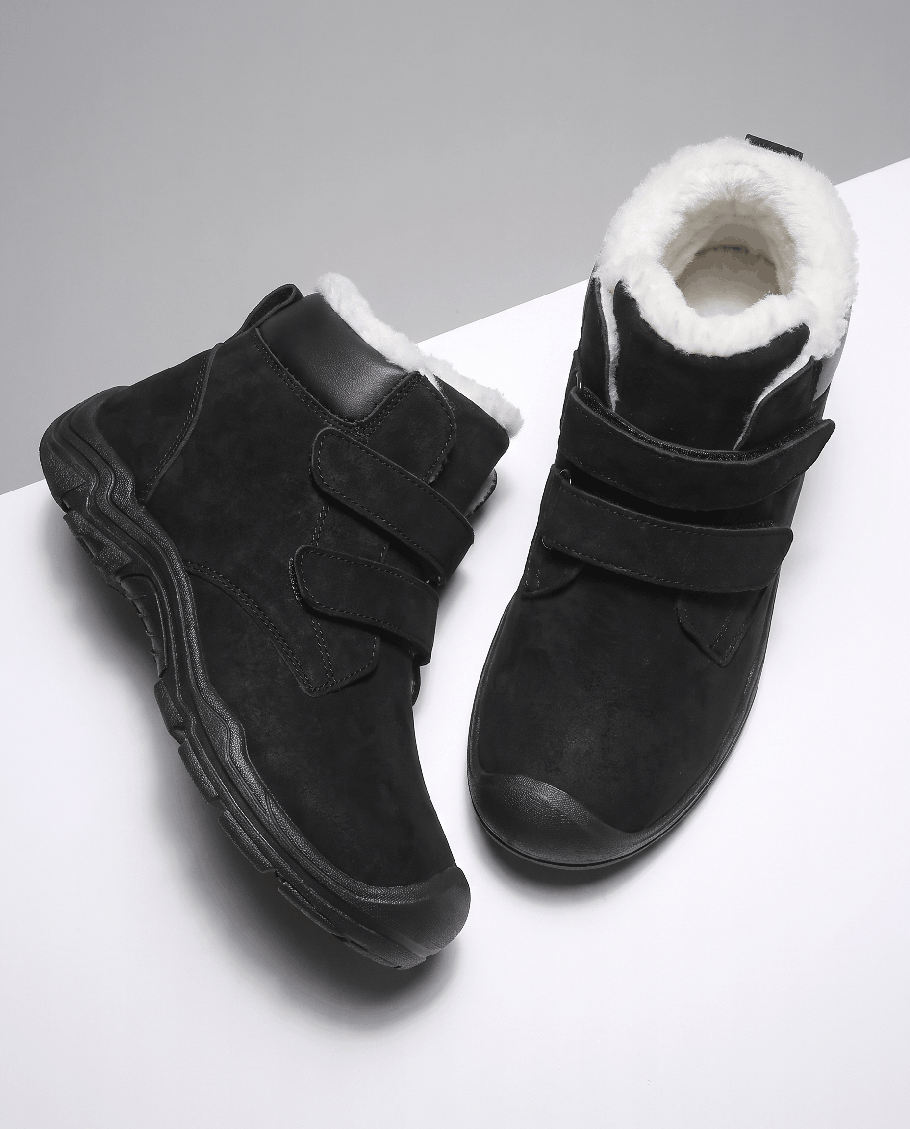 Pair of black insulated ankle boots shown from above.