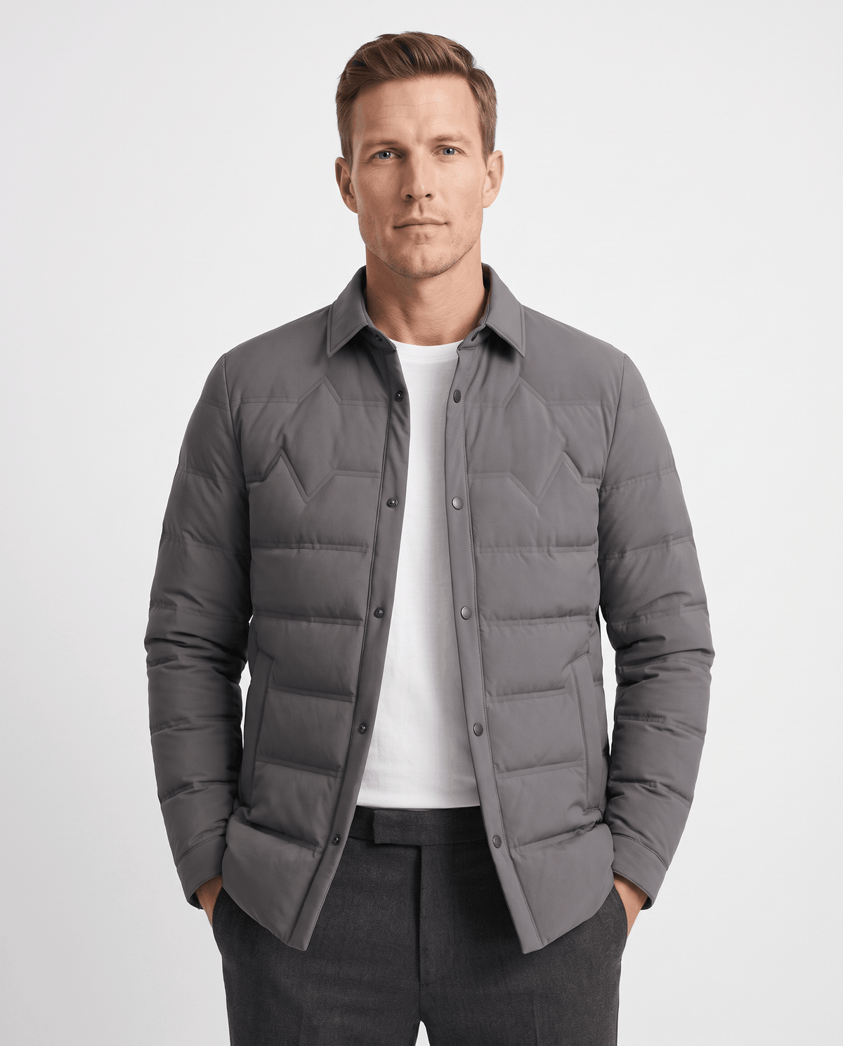 Man wearing a gray quilted duck down puffer jacket with snap front, front view
