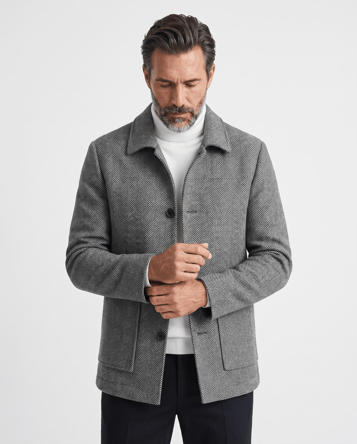 Man wearing the Henrik gray herringbone wool coat, front view