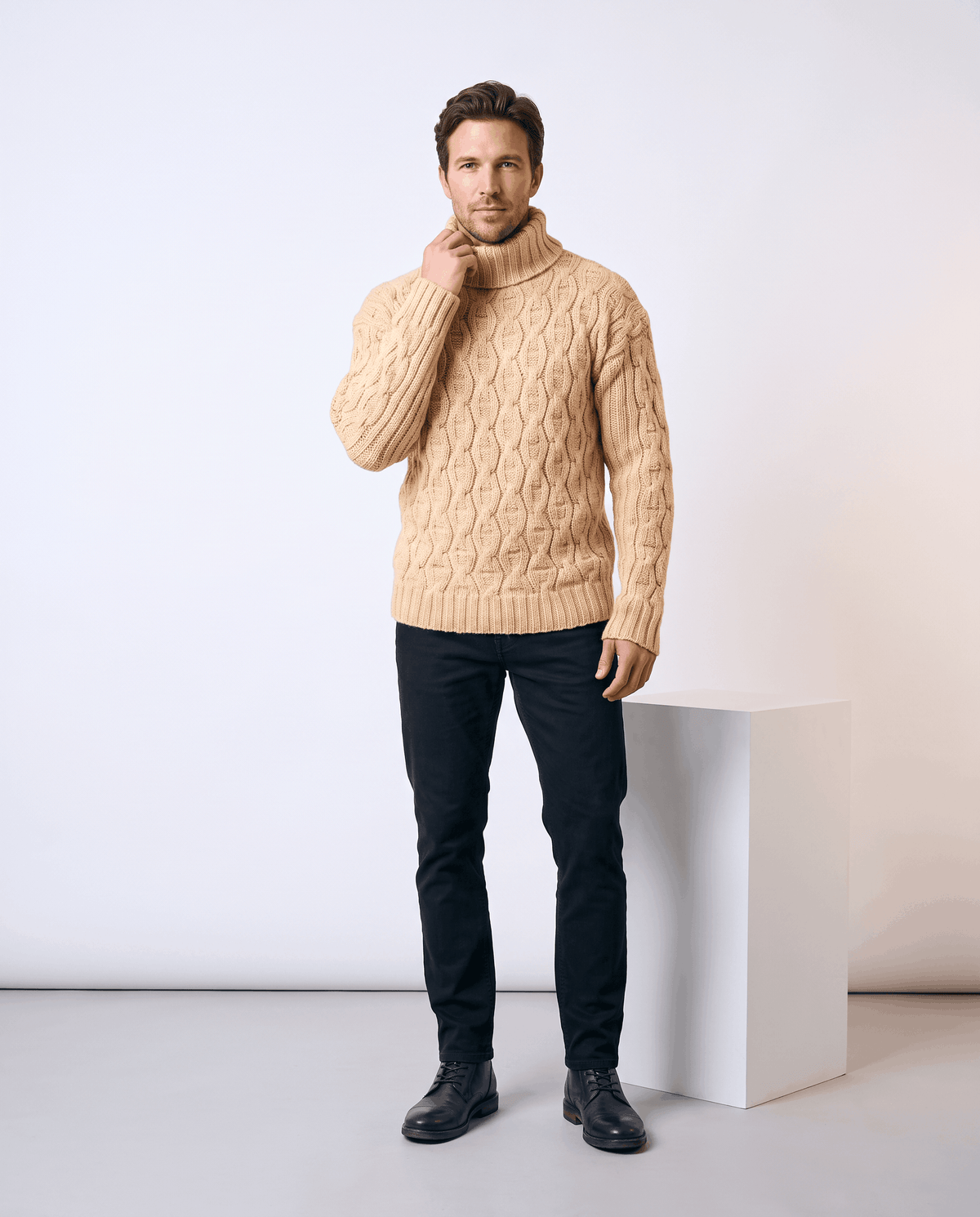 Full-length sand beige turtleneck outfit with black trousers and black boots