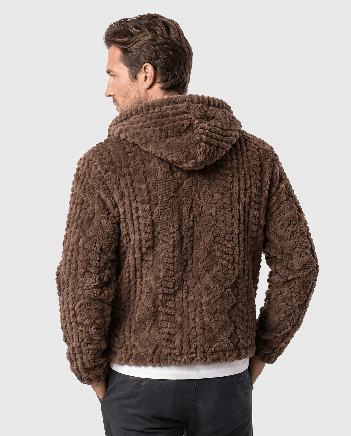Back of dark brown hooded jacket showing the hood and cable-knit pattern