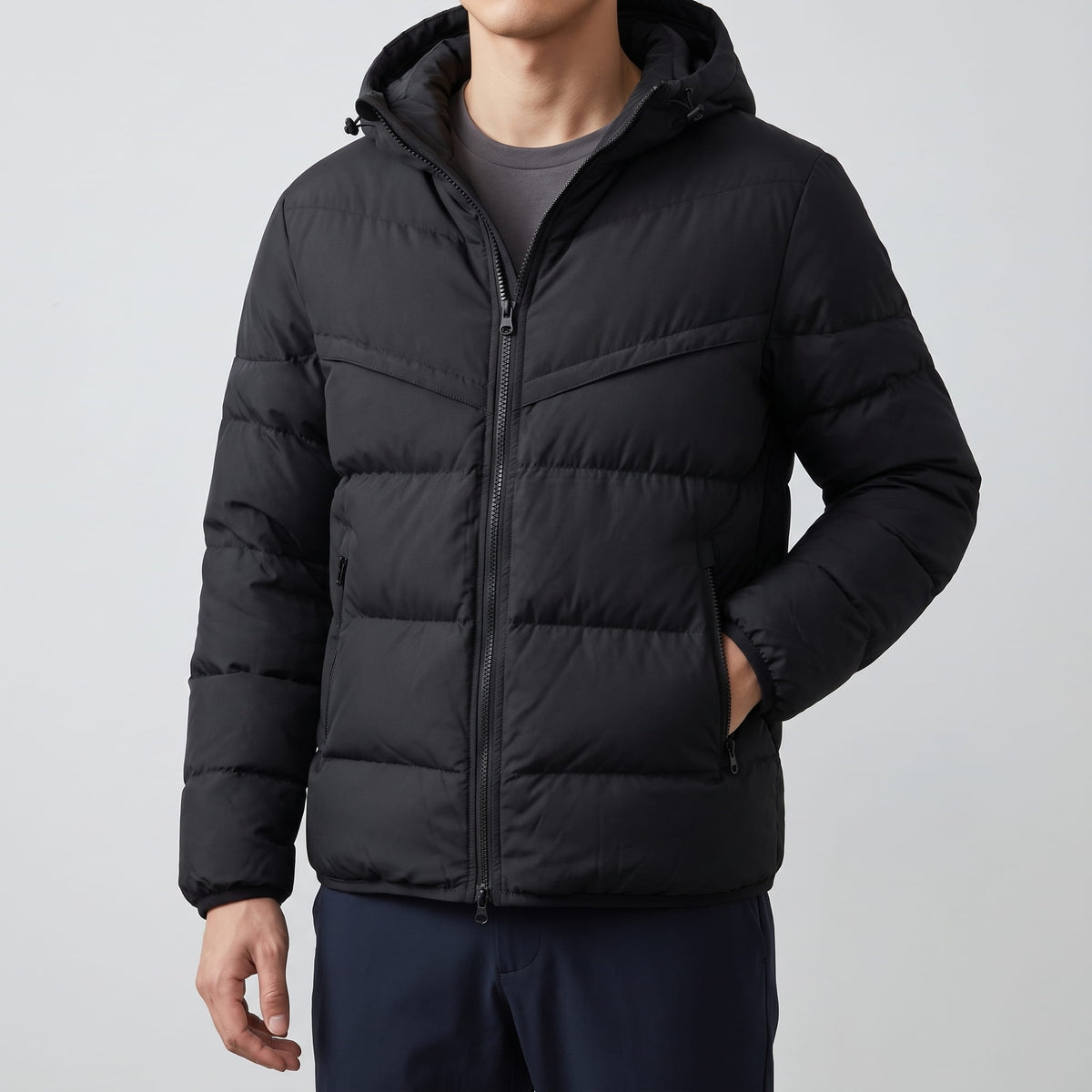 Black jacket torso showing tonal chevron yoke seam and quilted rows