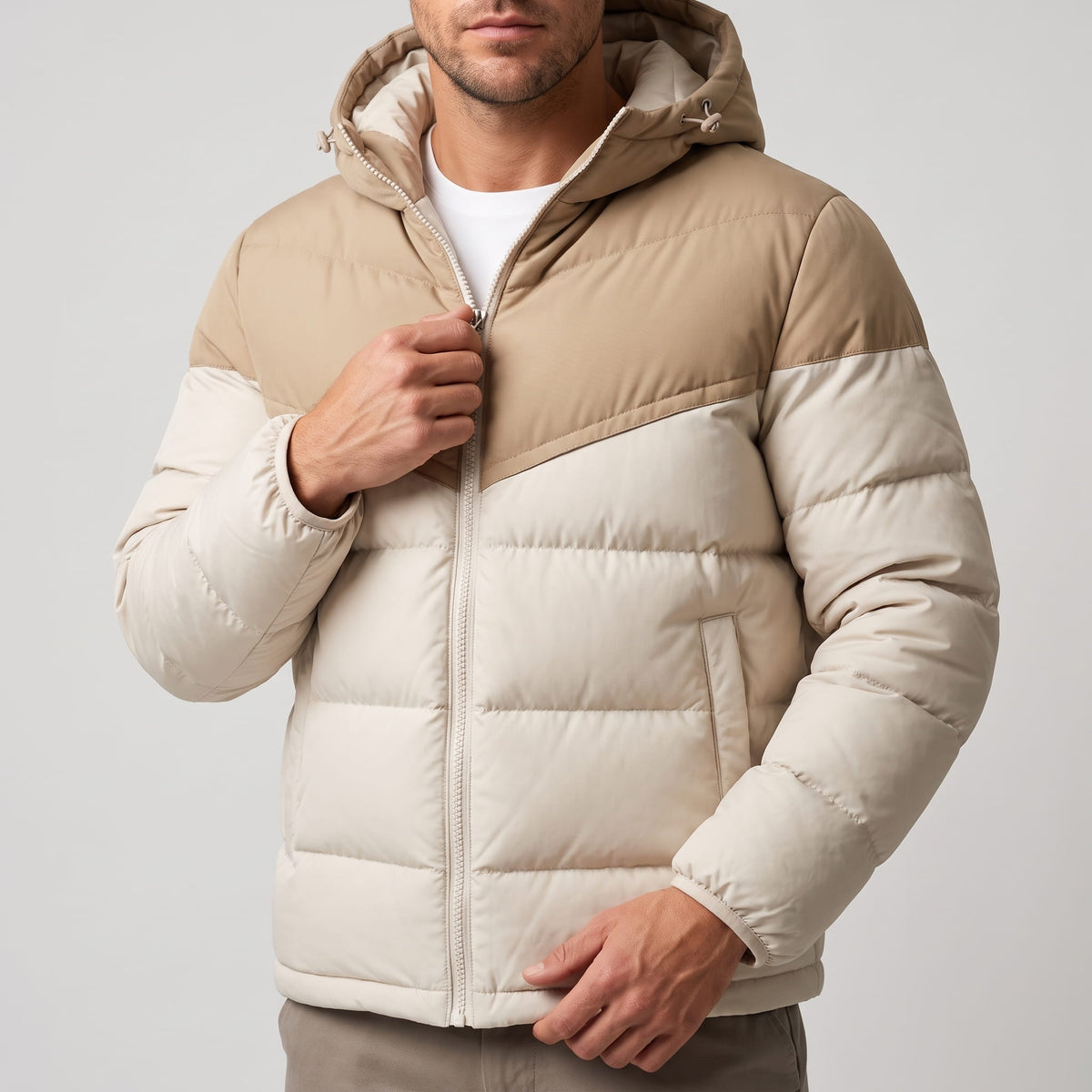 Cream jacket torso showing the tan yoke panel and chunky quilted channels
