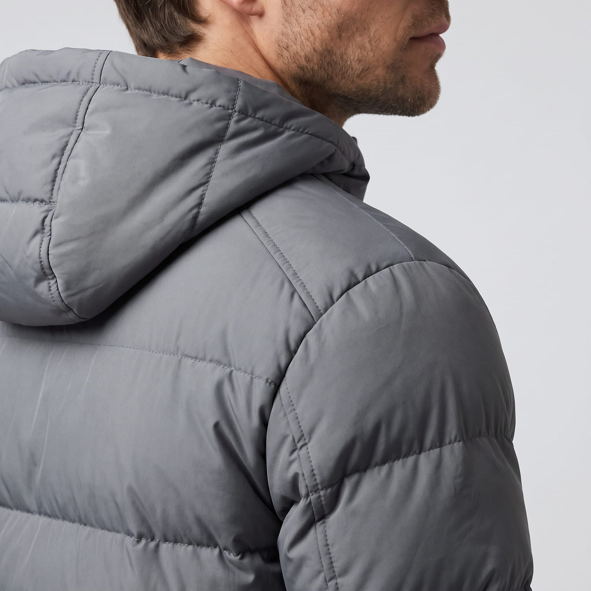 Close view of the gray hood and shoulder, showing deep quilted baffles