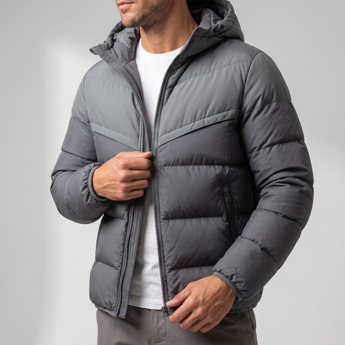 Gray jacket torso with the chevron yoke seam running across the chest