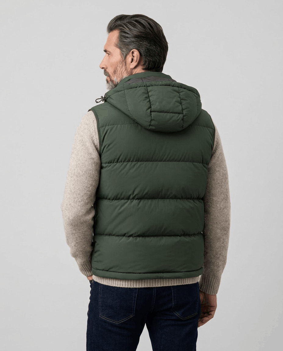 Back view of green quilted vest with attached hood and horizontal stitched channels