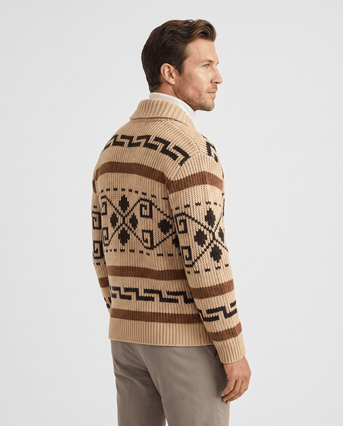 Back view of khaki jacquard zip cardigan with geometric pattern worn with stone trousers