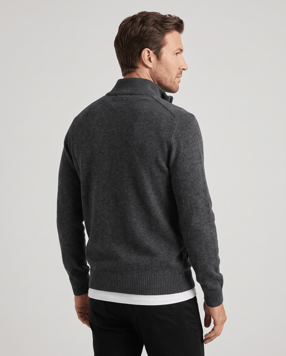 Back view of the dark gray zip cardigan with ribbed hem