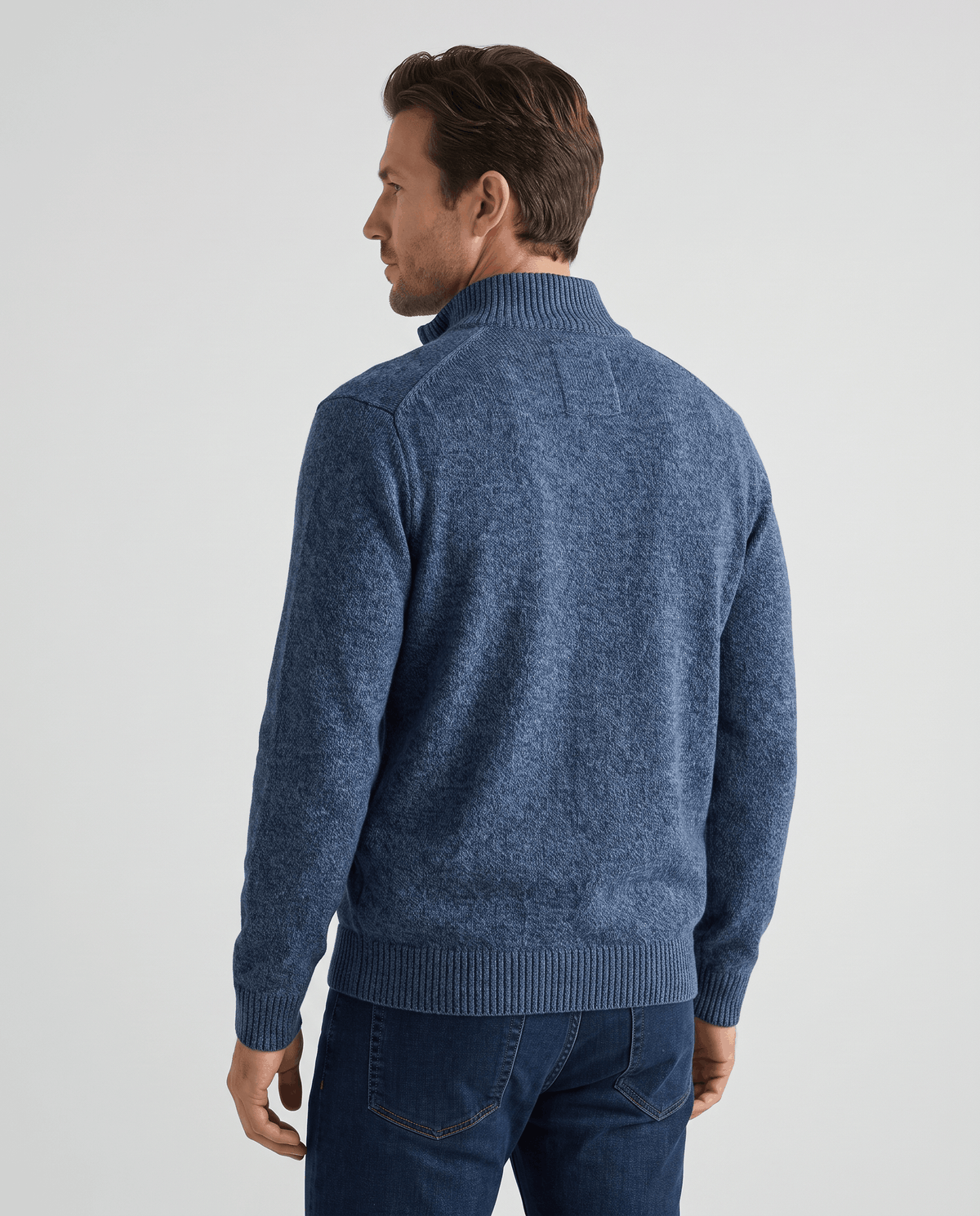 Back view of the navy knit zip cardigan with ribbed cuffs and hem