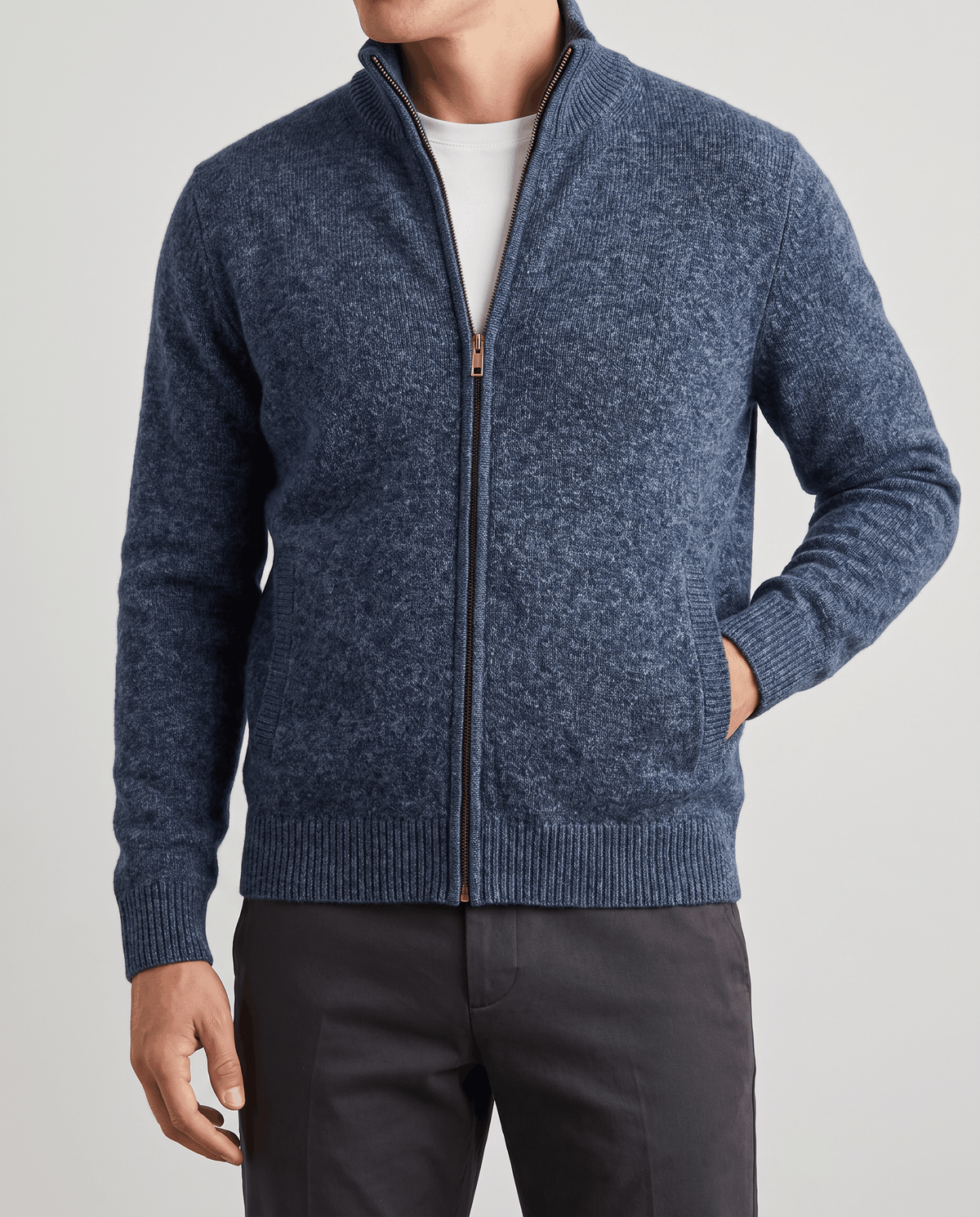 Close-up of the navy textured knit cardigan with a hand in the side pocket