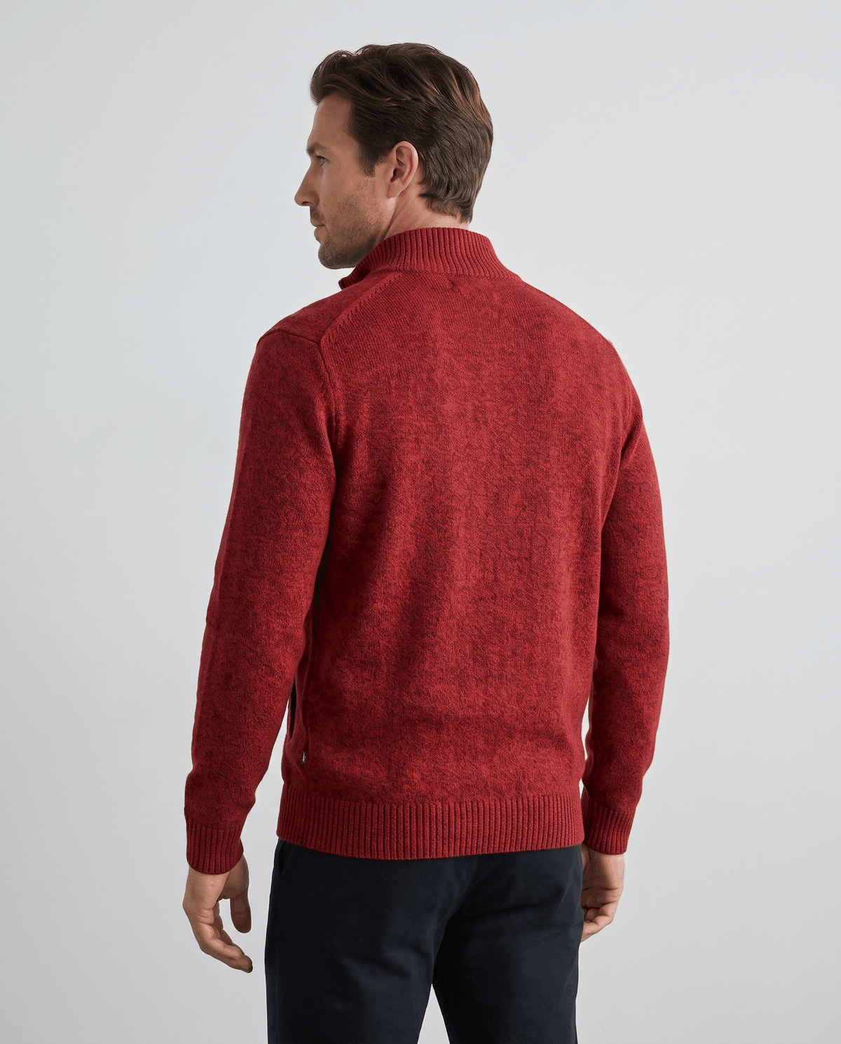 Back view of the red zip-up cardigan with ribbed hem