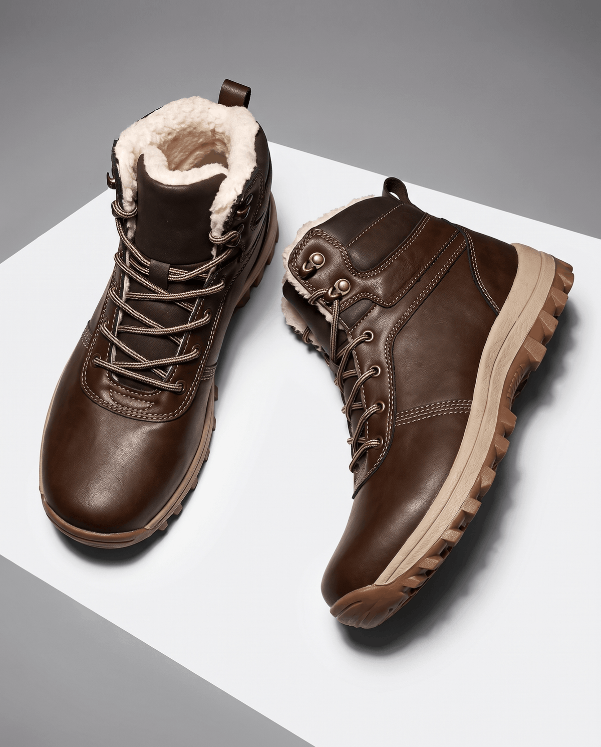 Dark brown pair angled apart, plush pale lining folded out around each collar