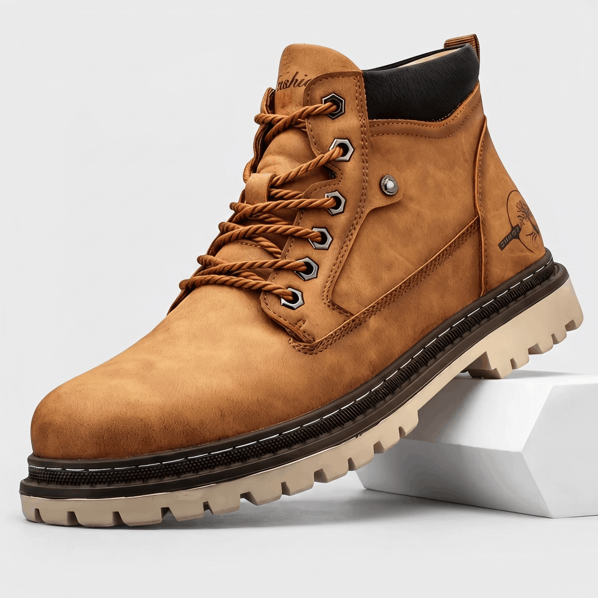 Brown matte textured leather work boot with a stitched welt, chunky lug sole, padded black ankle collar, and hex eyelets.