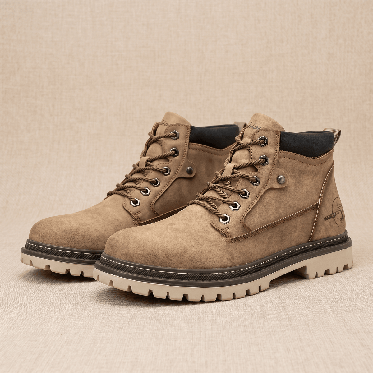 Khaki matte grain lace-up work boots featuring a stitched welt, chunky lug outsole, padded collar, and bolt-style eyelets.