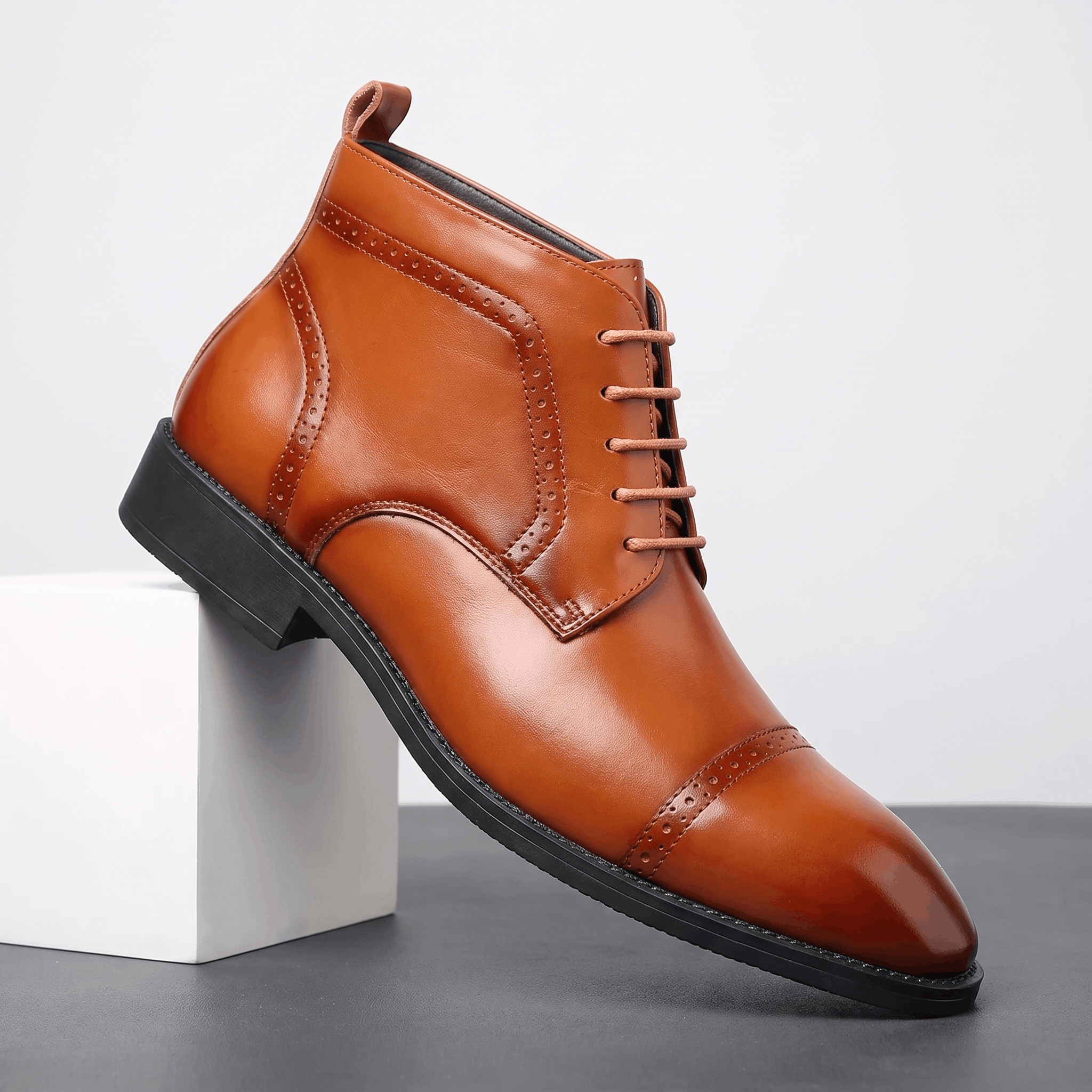 Brown leather brogue boots featuring a punched cap toe, five-eyelet lace-up closure, and a slim non-slip rubber sole.