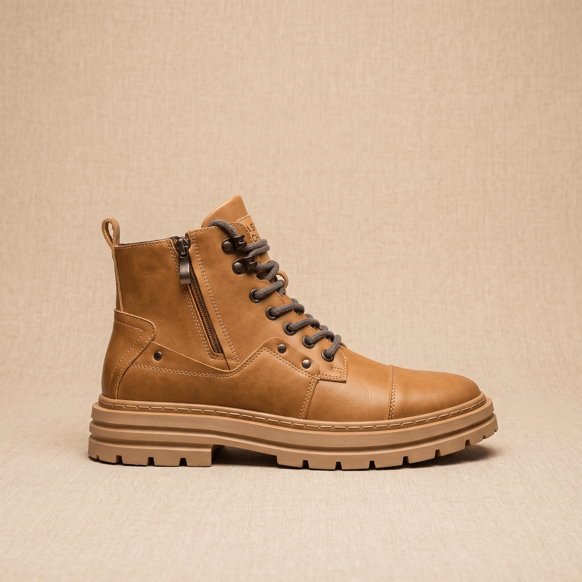 Tan leather combat boot with side zip, lace-up front, reinforced cap toe, and a chunky, lugged rubber platform sole.