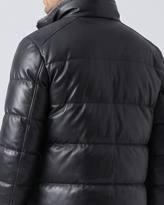 Back detail of the black bomber showing horizontal quilting across the shoulders