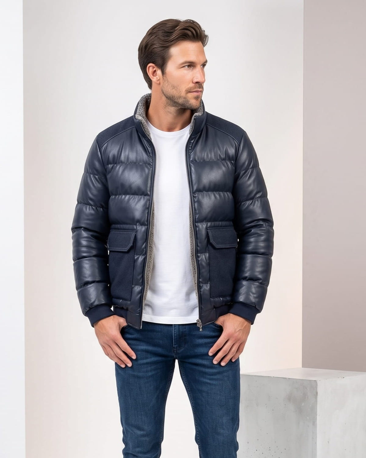 Man wearing the blue Northstar leather-look bomber over a white tee with blue jeans