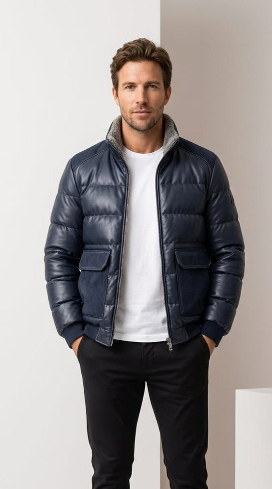 Blue Northstar leather-look puffer bomber worn zipped, showing flap pockets and ribbed hem